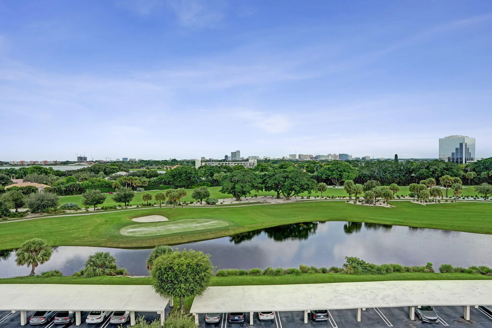 Wide golf-course and lake panorama