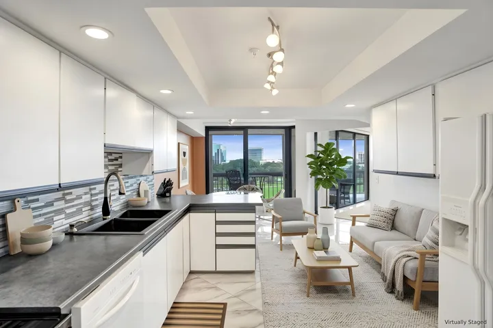 Virtually staged using AI – kitchen and living area