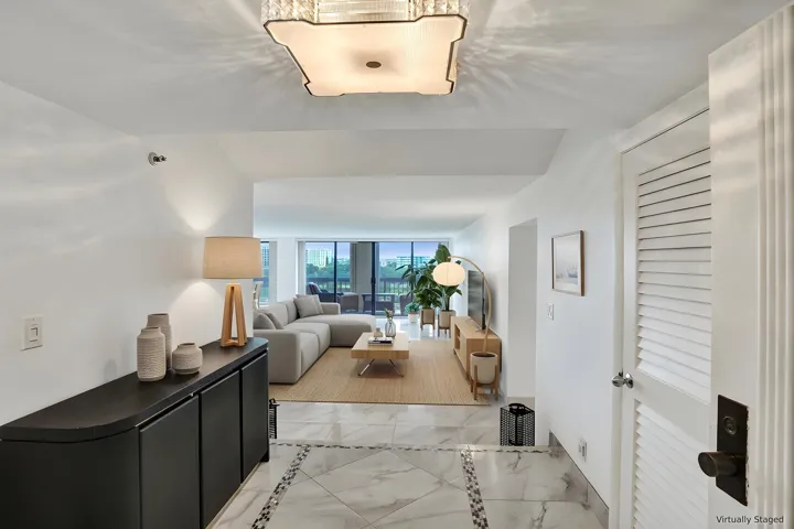 Virtually staged using AI – entry foyer and living room