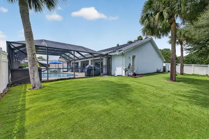 Enclosed side yard with artificial turf