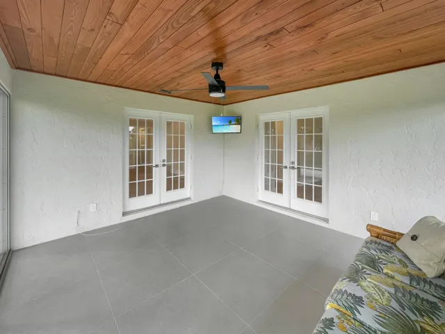 Wood plank ceiling with a modern ceiling fan