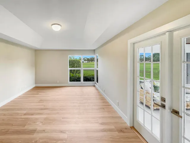 Spacious primary bedroom with fairway views