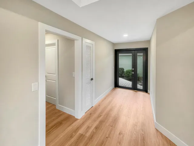 Foyer entry with new impact glass door that bathes the home in more natural light