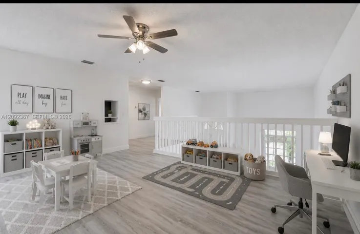 VIRTUALLY STAGED - Other Side of Large Loft Upstairs staged for Office/Play area.