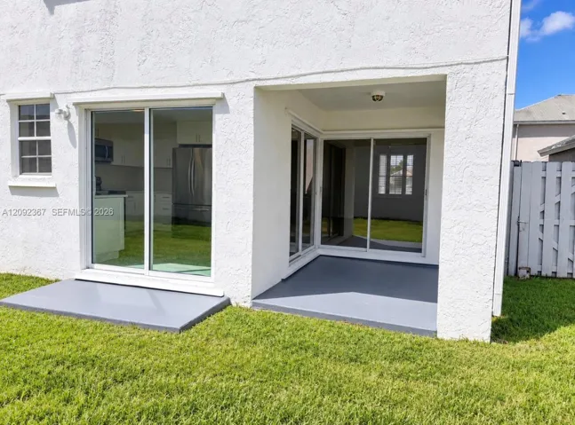 3 Sliding Glass Door to the private gated large back yard.