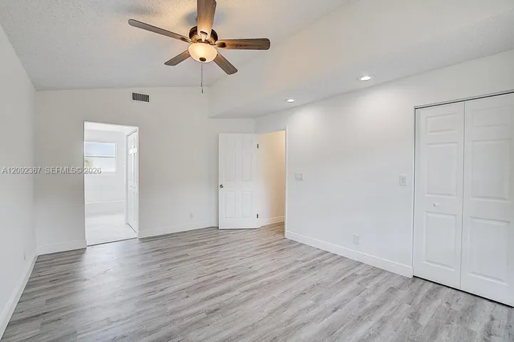 Primary Bedroom on first floor with primary bath and 2 walk in closets.
