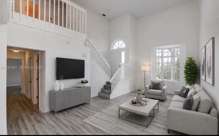 VIRTUAL STAGED - Step down to living area with Beautiful Bay window.