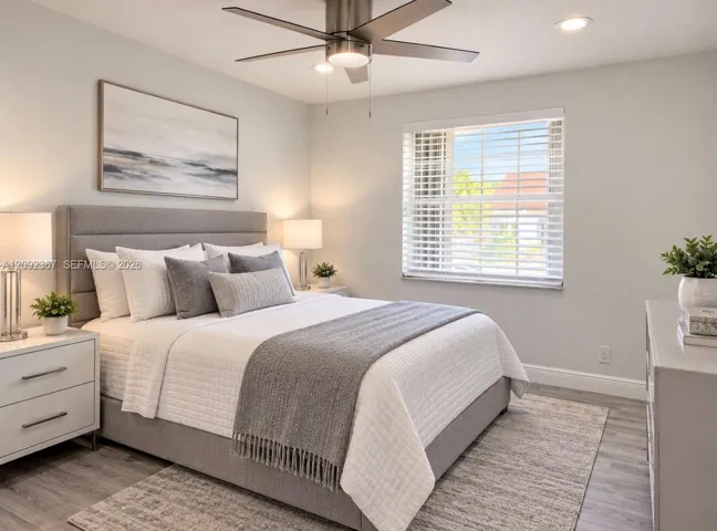 VIRTUAL STAGED - Upstairs Front Bedroom with window.