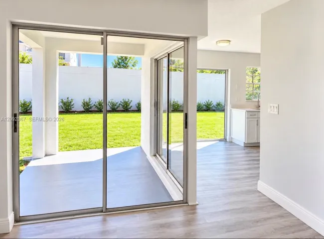 VIRTUAL STAGED back yard from Sliding Glass Doors 1 from Dining Area and 2 from Kitchen.