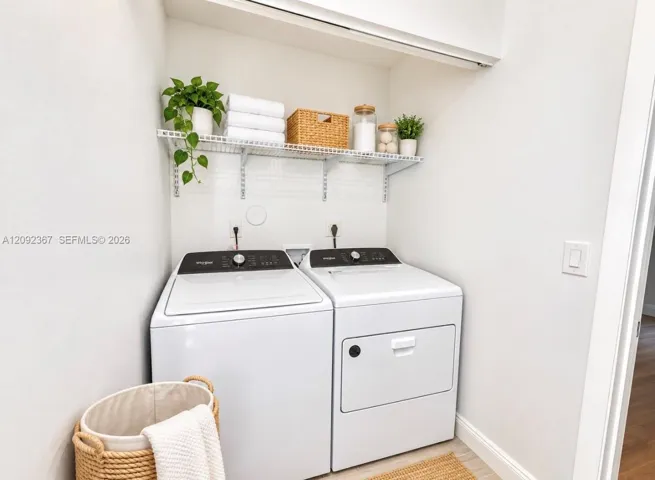 VIRTUAL STAGED - Laundry on first floor.
