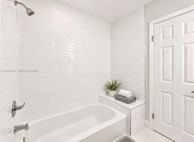 VIRTUAL STAGED - Upstairs Tub/Shower Combination.