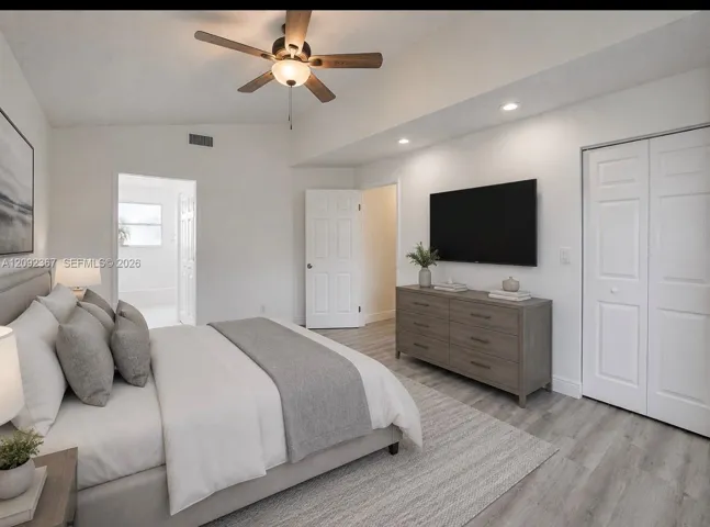 VIRTUAL STAGED - Primary Bedroom with 2 Walk- in Closets.