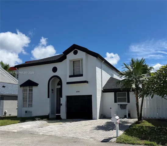 Front of Property with 1 car garage.