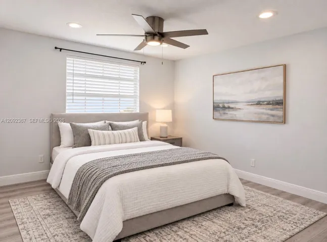 VIRTUAL STAGED - Upstairs 2nd Back Bedroom with window.