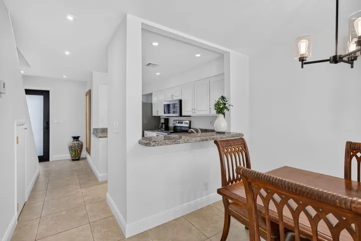Dining area looking back towards kitchen and entryway