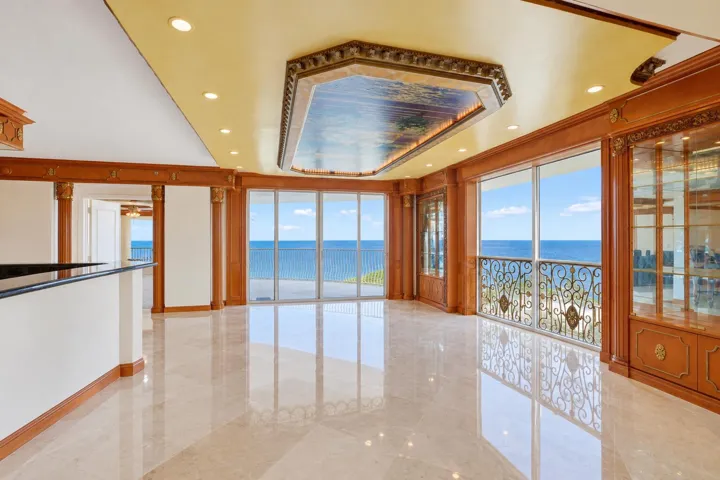 virtual staging removed furniture and window dressing. bar and formal living room