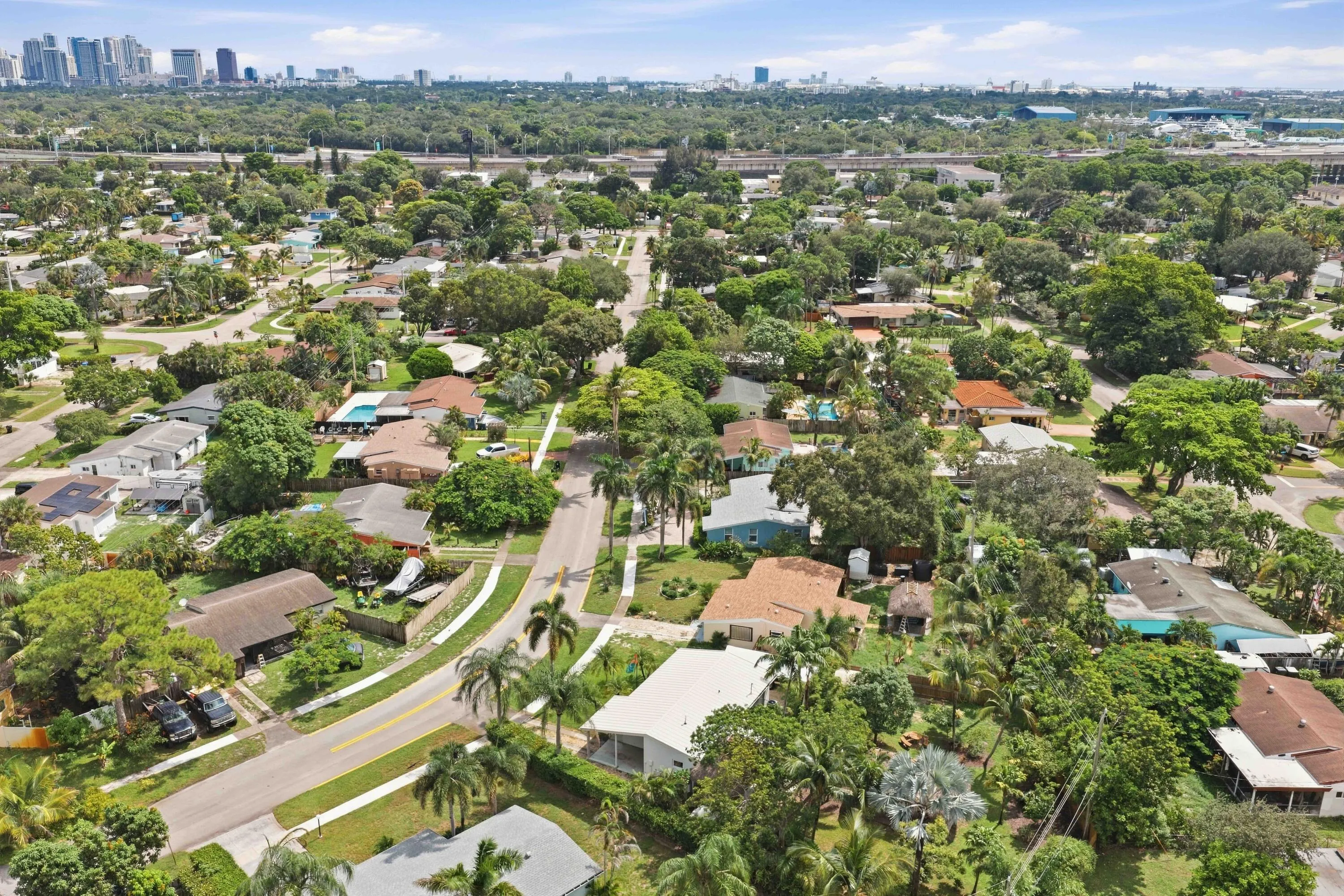 Expansive aerial perspective showcasing a residential area with mature landscaping