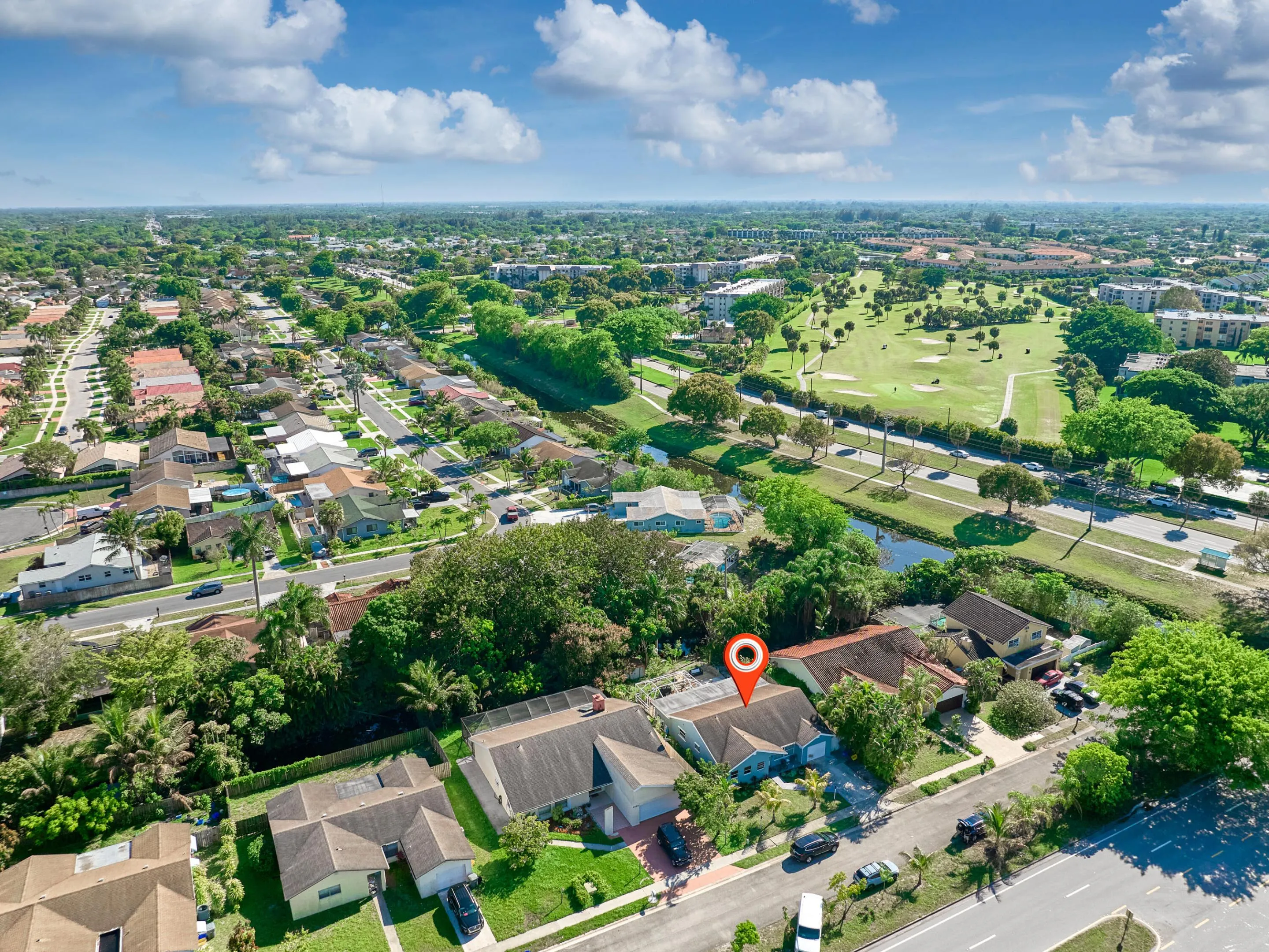 Residential neighborhood with mature trees, established roadways