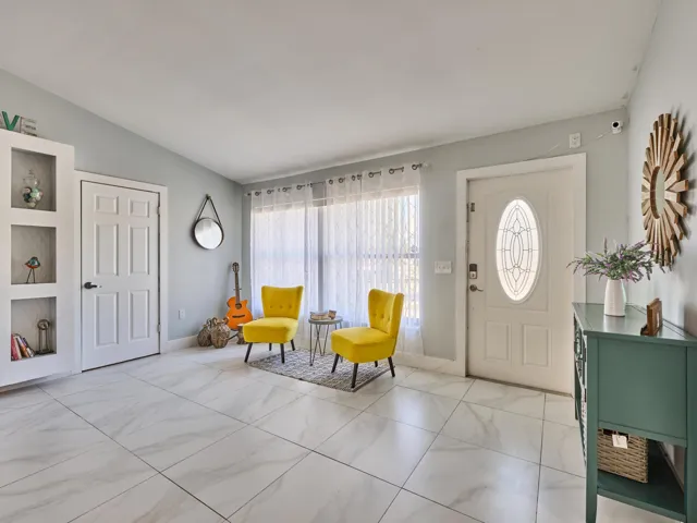 White tile flooring with a subtle marble-style pattern