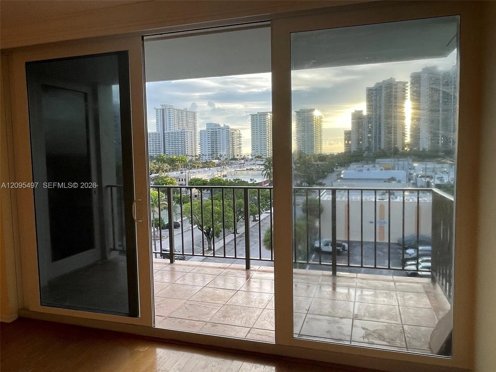 Living and master bedroom sliders lead to spacious balcony.