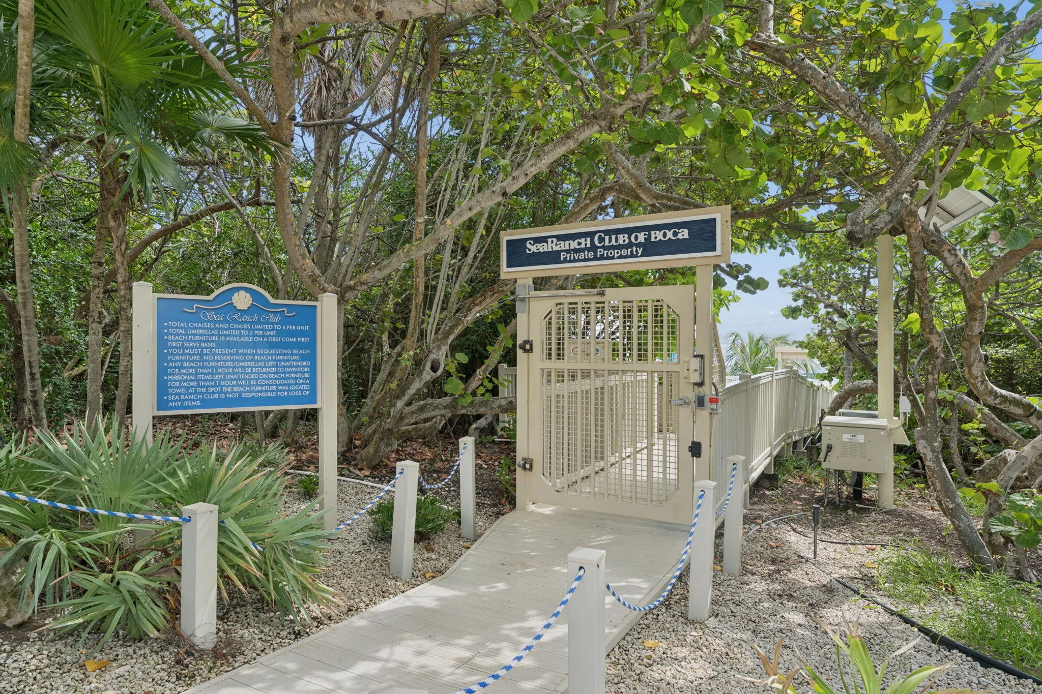 private beach entrance cabanas and umbrellas