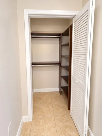 Second Closet. This is in the office space. Featuring a closet organizer.