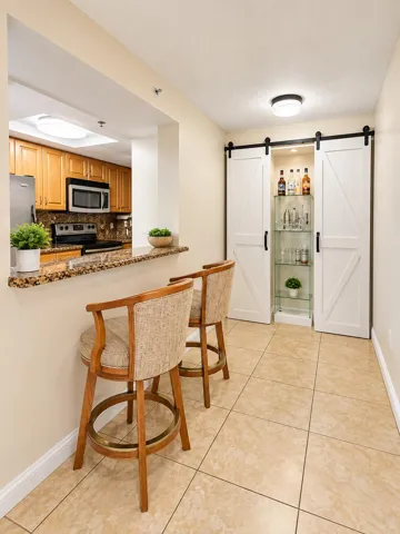 Countertop seating. Decorative Barn Door Bar. A small table would be fine here if you didn't want countertop seats.
