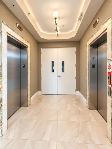 Building Elevators and Entryway to your 2 covered parking spaces.