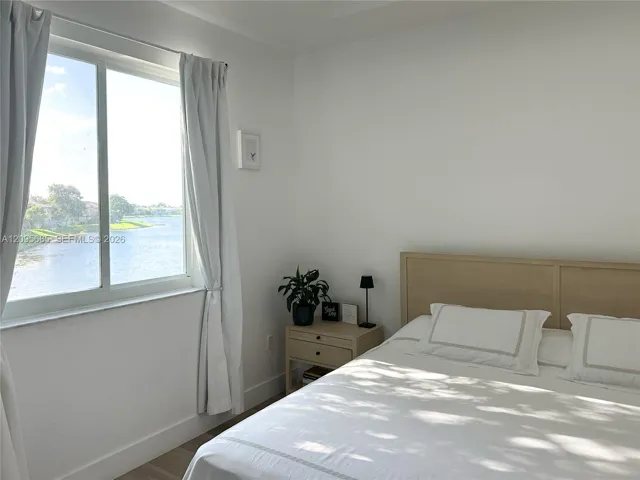 Primary bedroom with lake views.