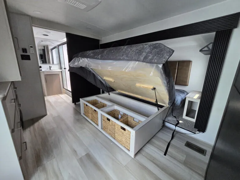 RV: Master bedroom suite. King bed lifts for additional storage