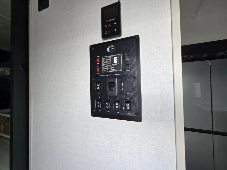 RV: Display panel inside entrance door to control lighting and water supply and water heating