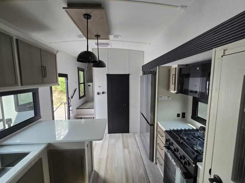 RV: Through view from kitchen with powder room to steps to master bedroom with en suite bathroom