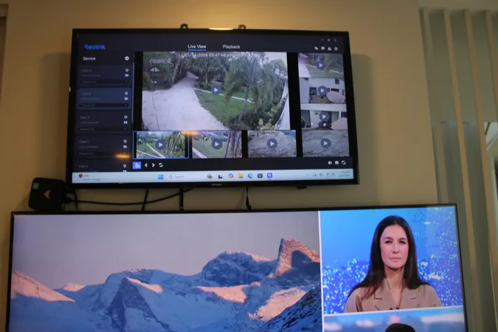 8 camera security camera / lighting system displayed on a dedicated screen above the kitchen TV