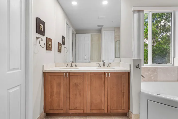 Dual vanity with oversized mirror