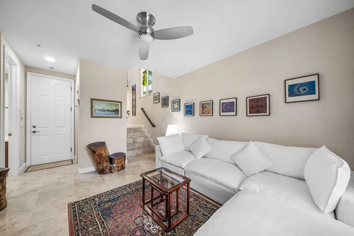 Head down to your own den and en-suite bedroom with patio access