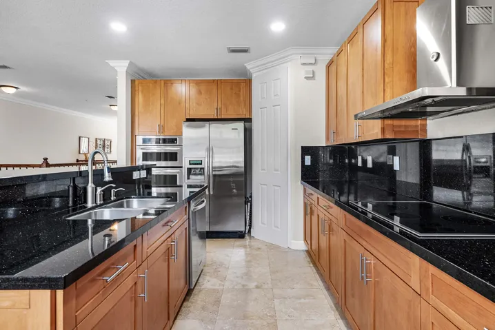 Stainless steel appliances and a range hood