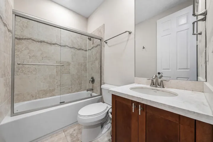 Updated Vanity, Glass Shower Door, Tiled Wall at Shower and vanity-to-ceiling mirror