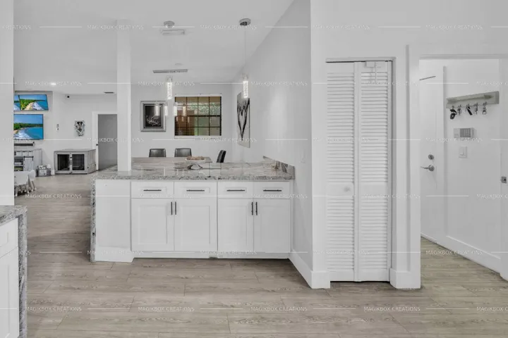 Laundry room to the side on the way to garage.