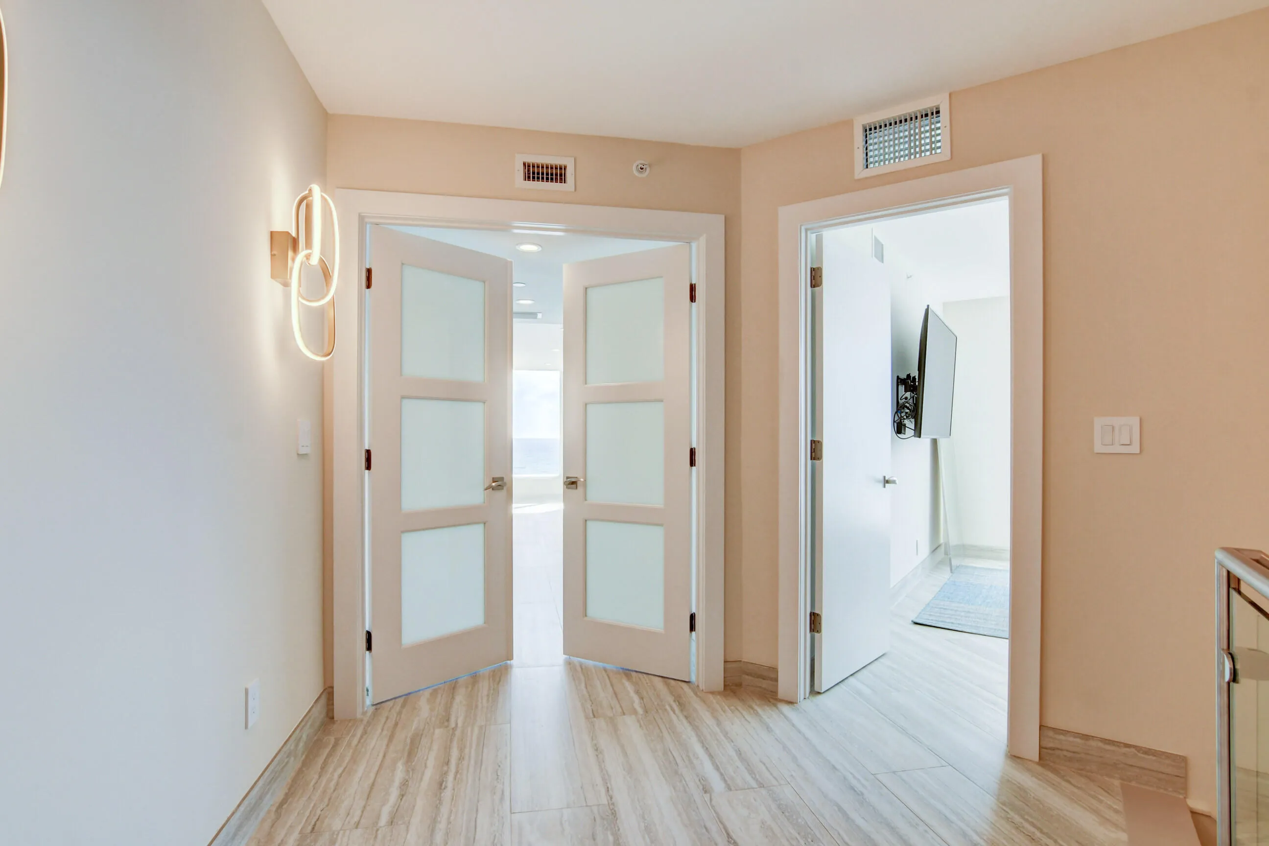 Frosted Glass doors upon entering the Master Suite, Guest BR on right side of entry.