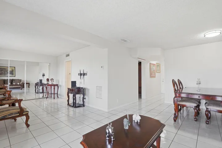 View of dining room and second bedroom/den from living room
