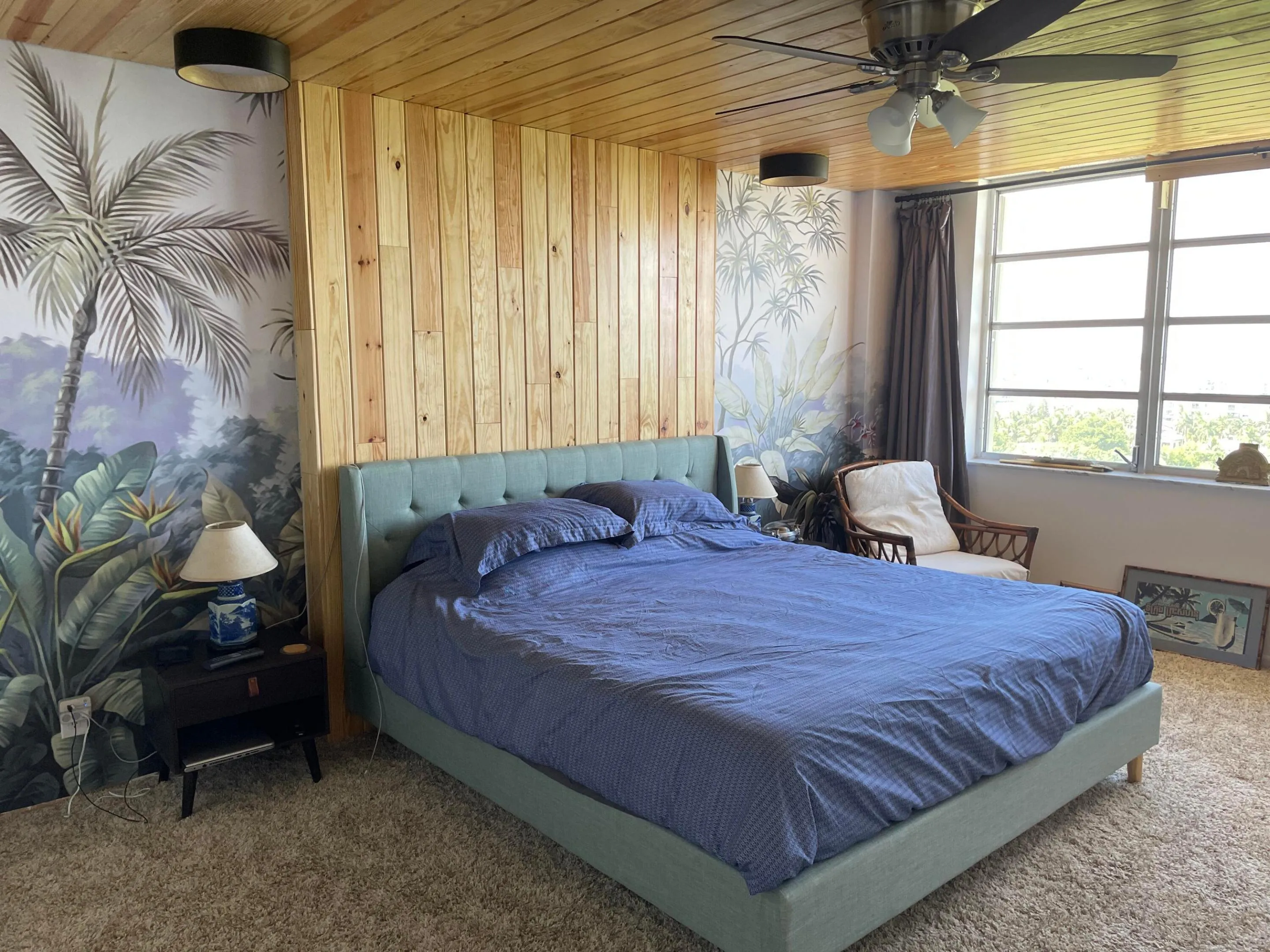 Wood-paneled ceiling with a ceiling fan