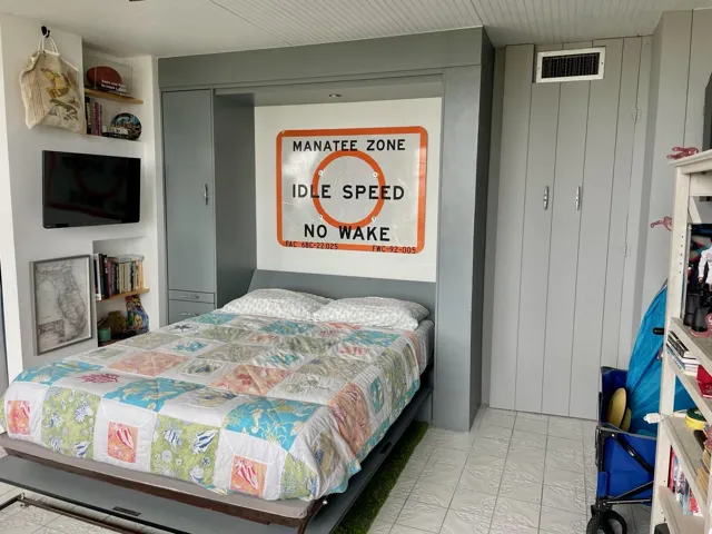 Built-in Murphy bed with integrated cabinetry and shelving