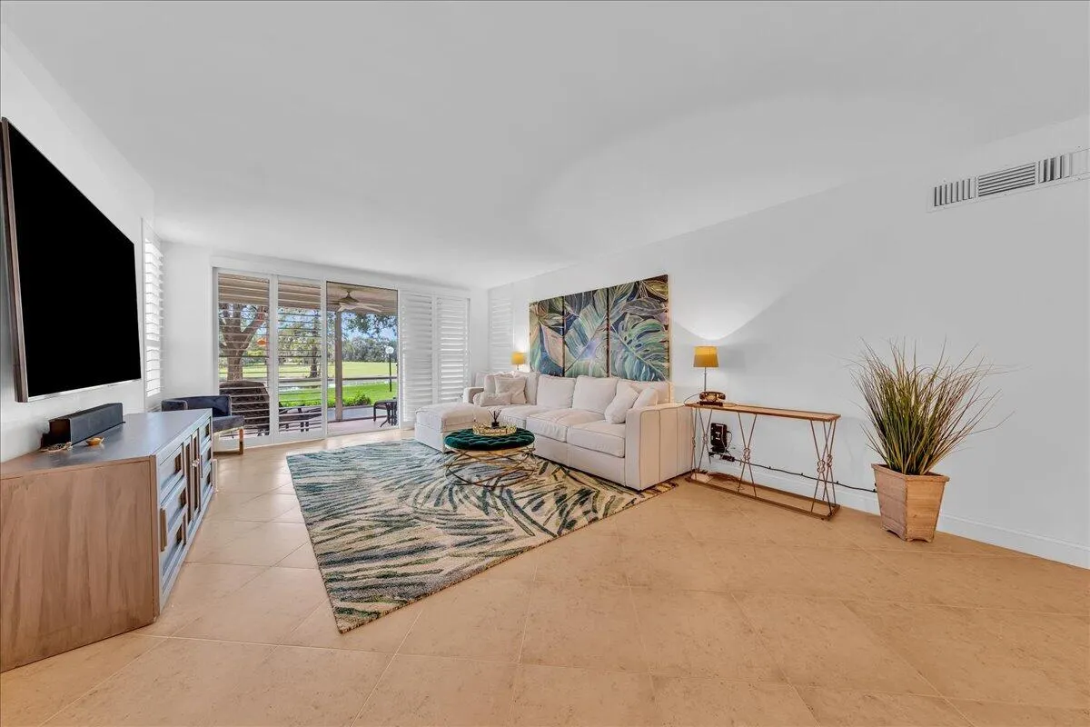 Neutral tile on the diagonal throughout the condo