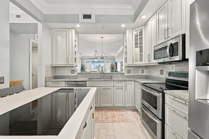 You will absolutely love the kitchen upgrades. Kitchen cabinetry has been upgraded w/ pull-outs, original granite has been replaced, and movable island provides for seating and extra cabinet space.