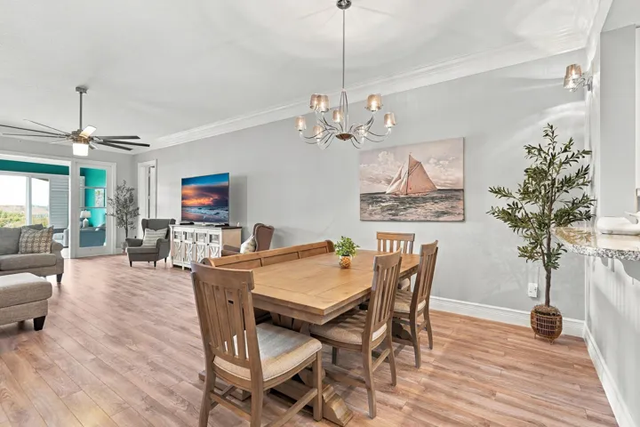 Luxury vinyl plank flooring in living areas, volume crown molding through-out, and updated lighting/fans.