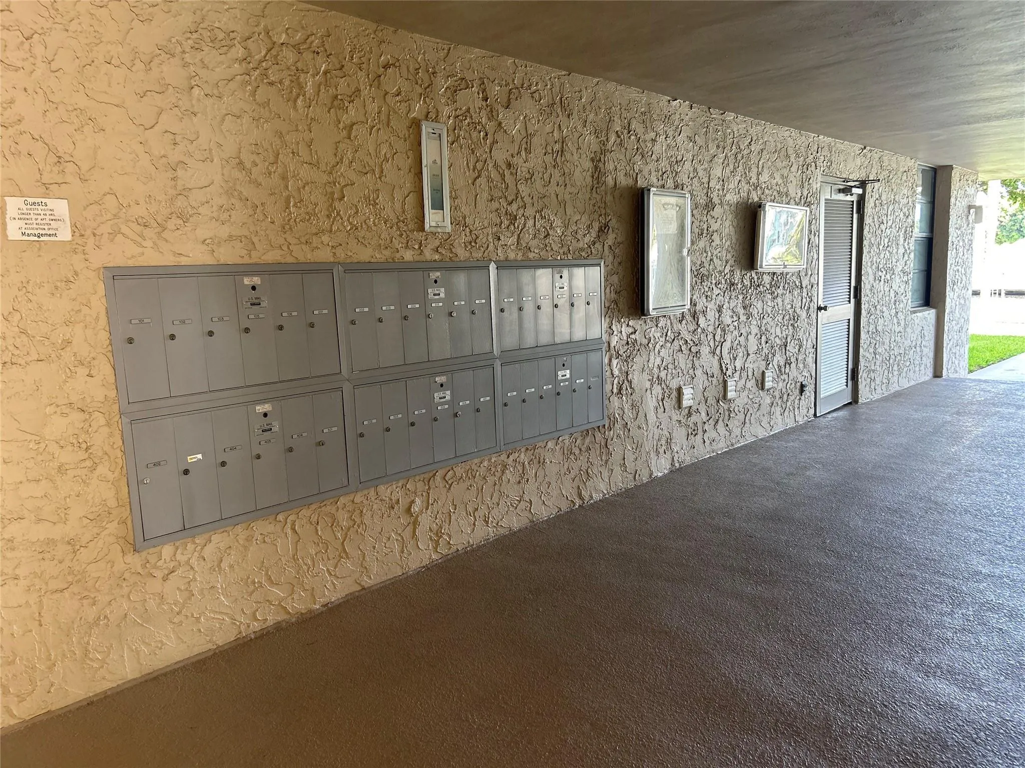 Textured wall finish with multiple mailboxes