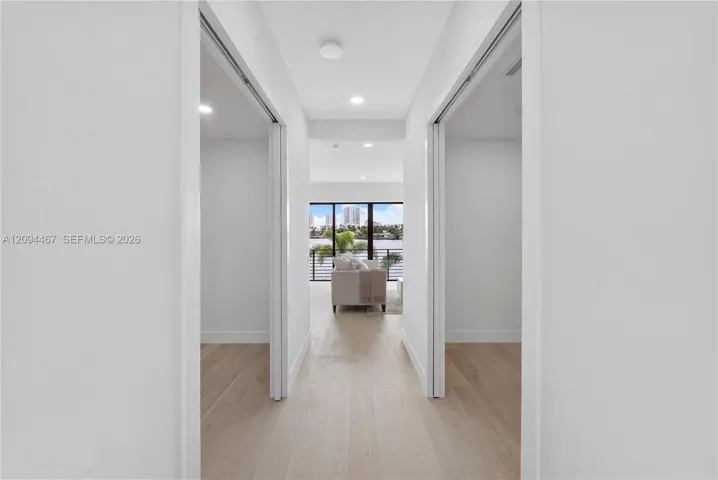 Second floor hallway and his & her closets on left and right