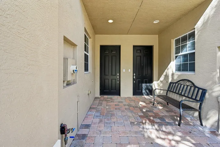 Covered entry with pavers and recessed lighting