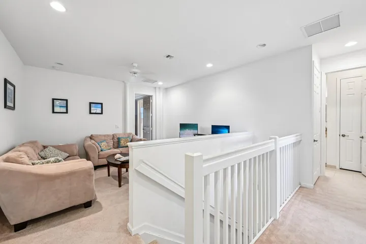 Loft area with recessed lighting, ceiling fan, and carpet flooring
