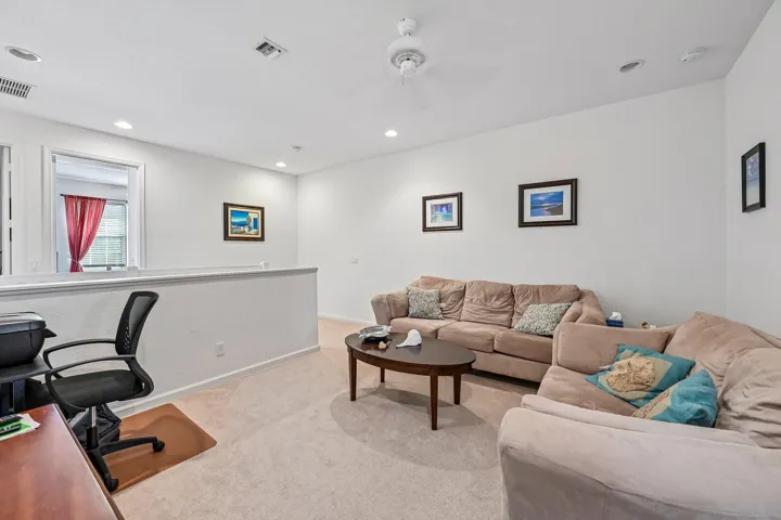 Loft space featuring recessed lighting, a ceiling fan, and carpeted flooring